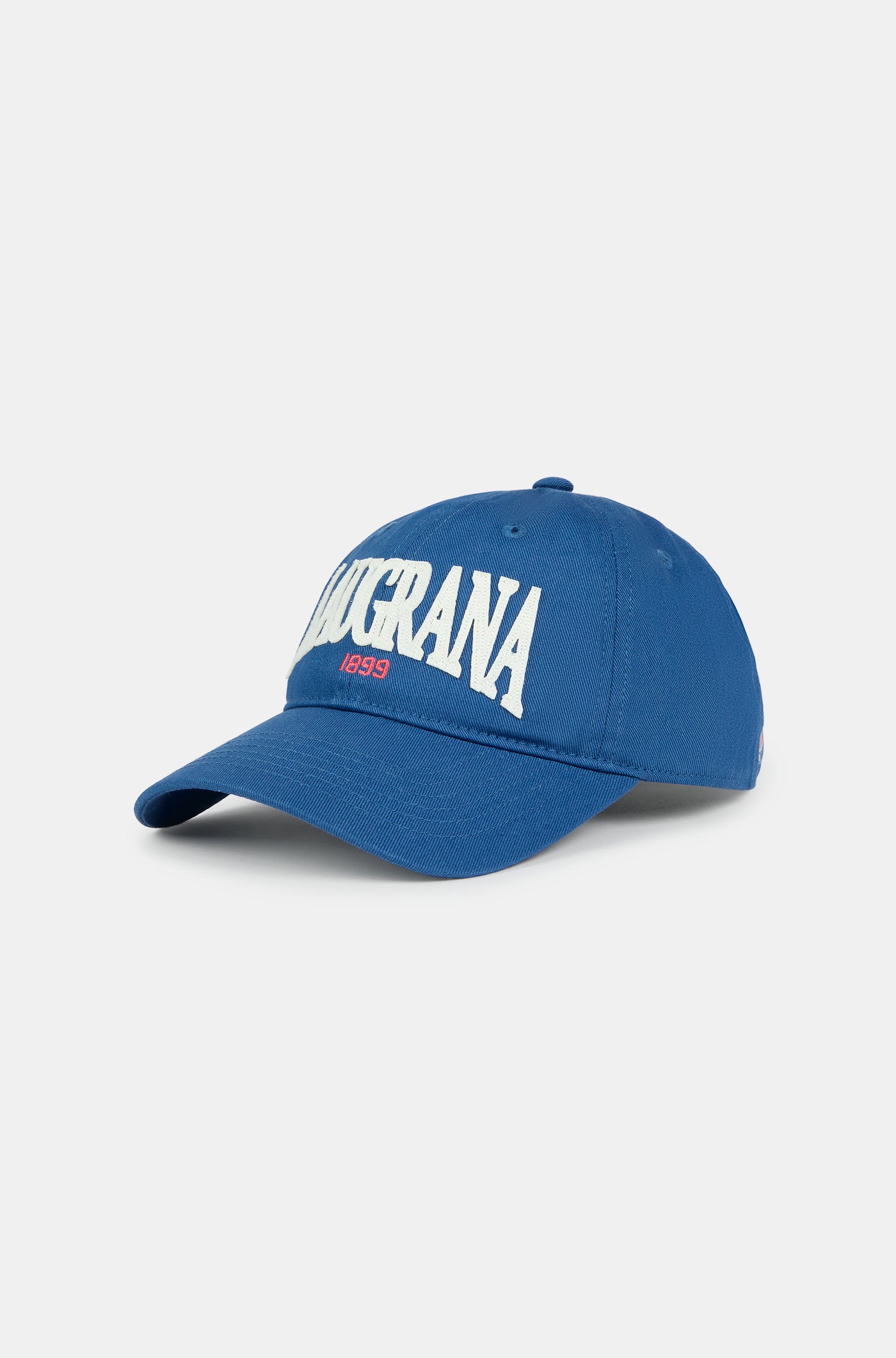 Blue FC Barcelona cap with "BLAUGRANA 1899" embroidered in white and red on the front, featuring a curved brim and a small Barça crest on the side.
