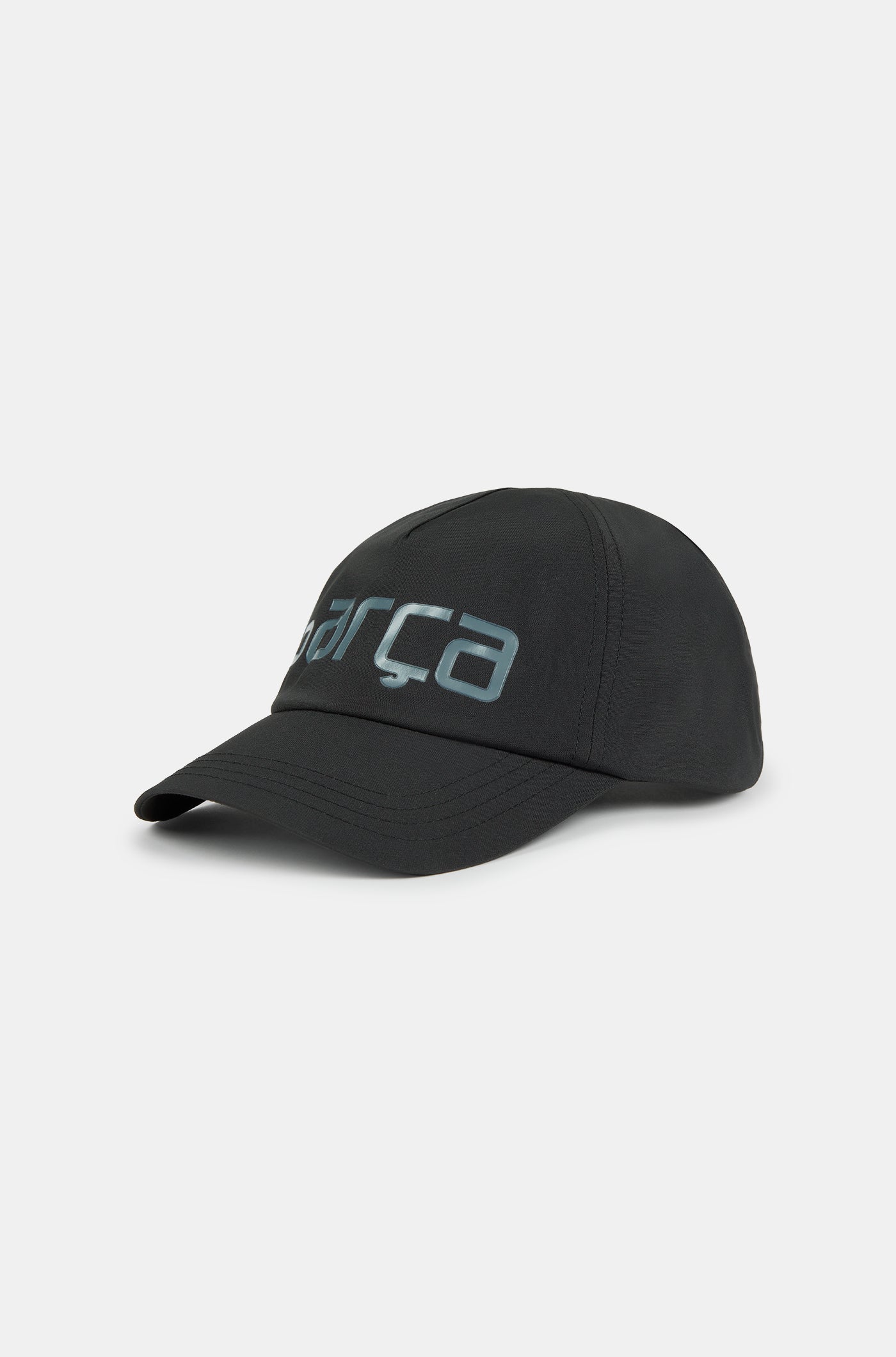 Black baseball cap with the word 'Barça' in metallic-style lettering on the front.