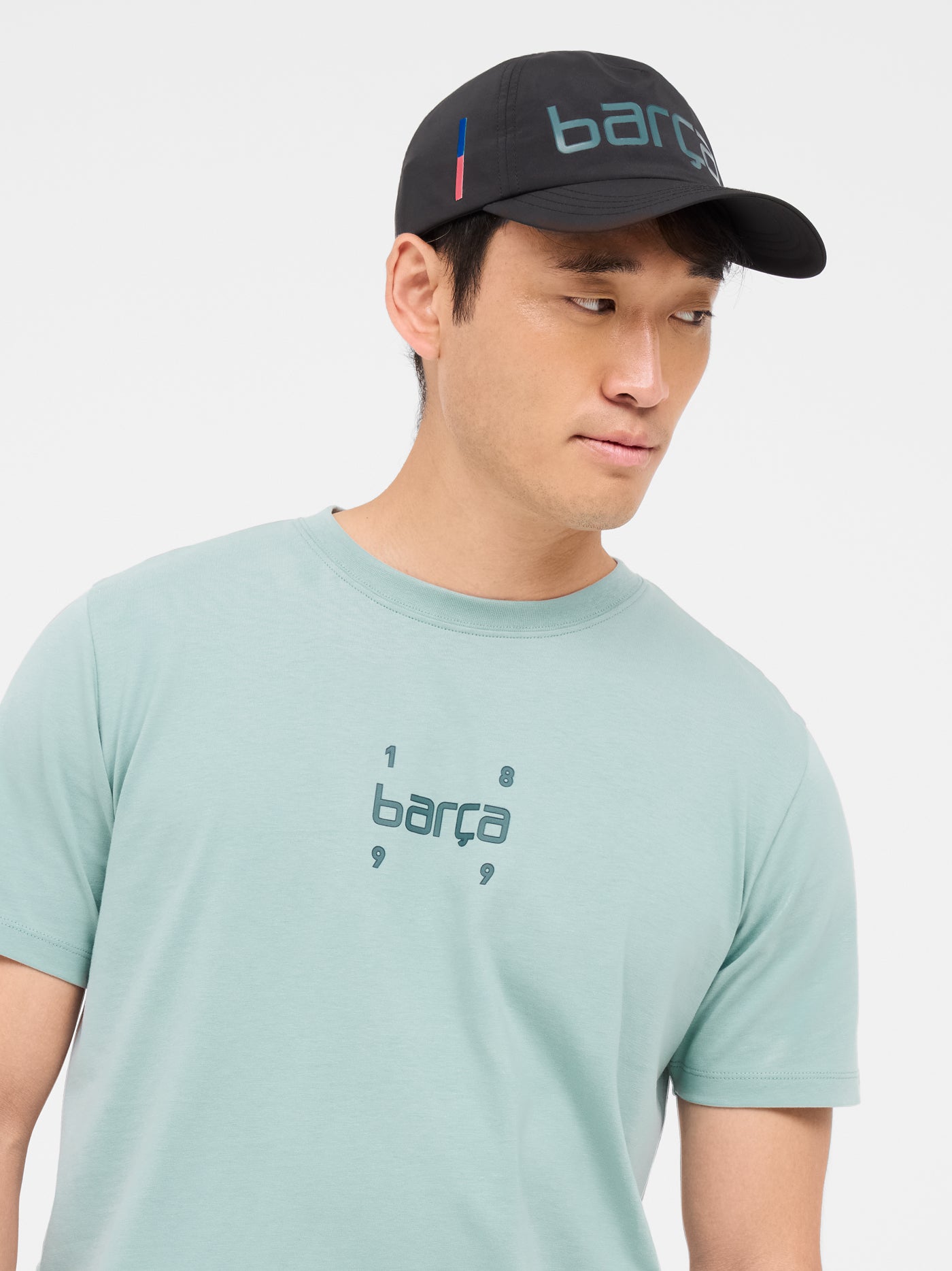 Black baseball cap with the word 'Barça' in metallic-style lettering on the front.