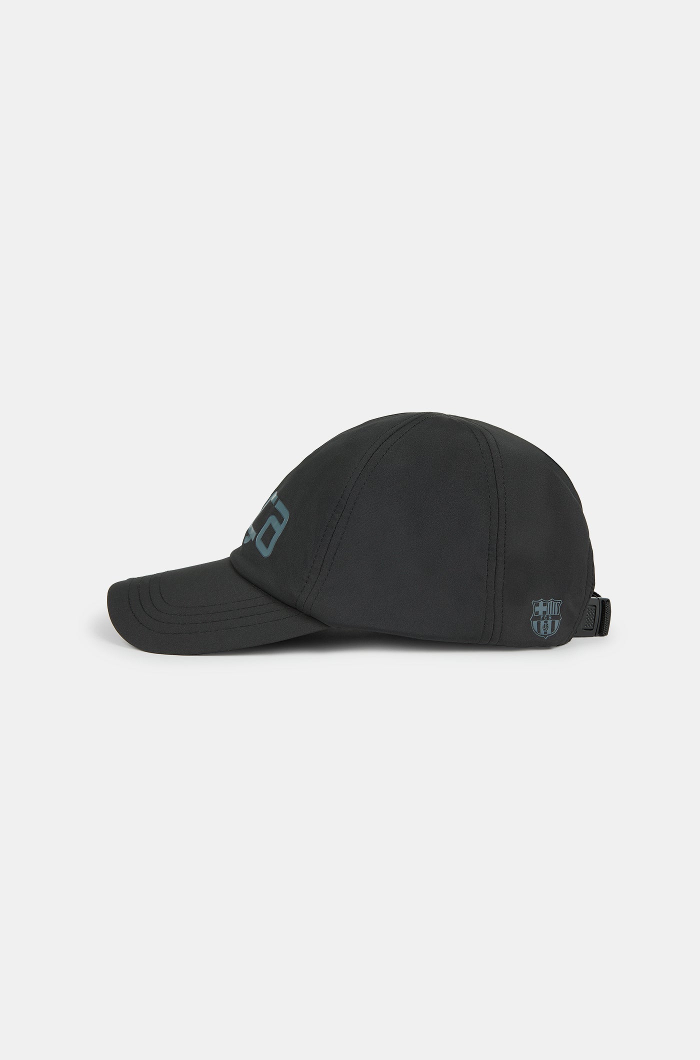 Black baseball cap with the word 'Barça' in metallic-style lettering on the front.