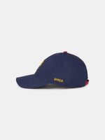 Half red, half navy blue baseball cap with the FC Barcelona crest on the front and 'Barça' text on the side.