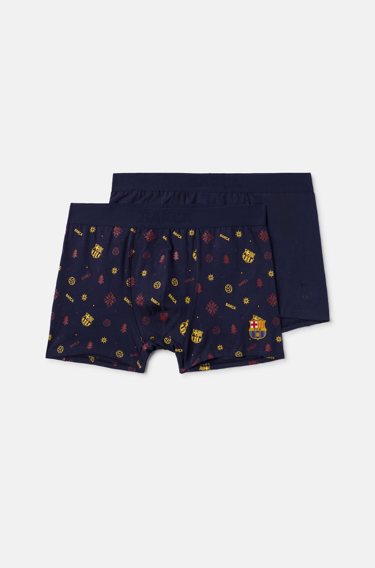 Dos calzoncillos bóxer de FC Barcelona en azul marino, uno liso y otro con un estampado integral festivo del escudo del Barça y motivos invernales.