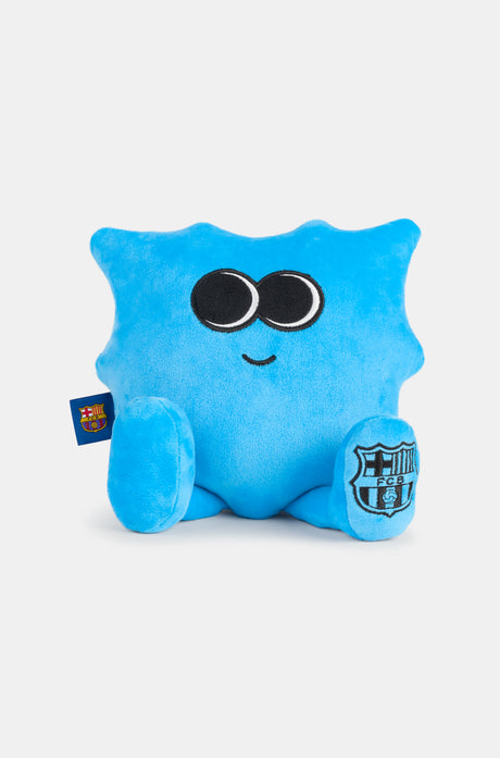 Blue plush toy with big eyes and a small smile, featuring the FC Barcelona crest on one foot and a club tag on the side
