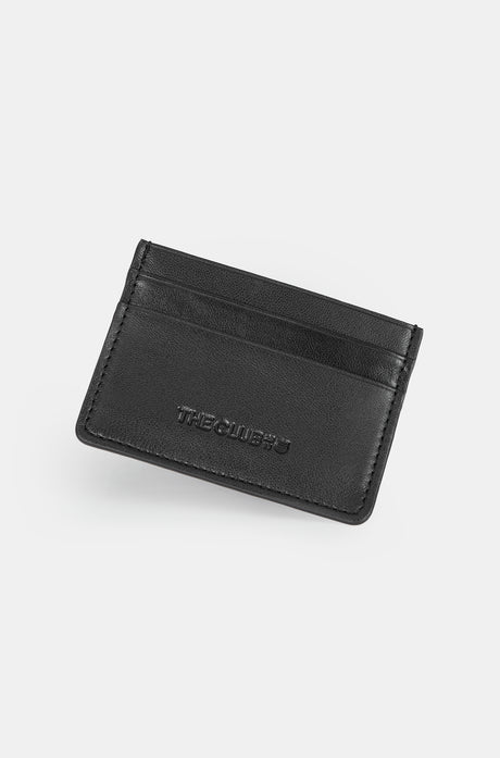 Black leather cardholder with embossed “THE CLUB” text on the front, featuring two horizontal card slots.

