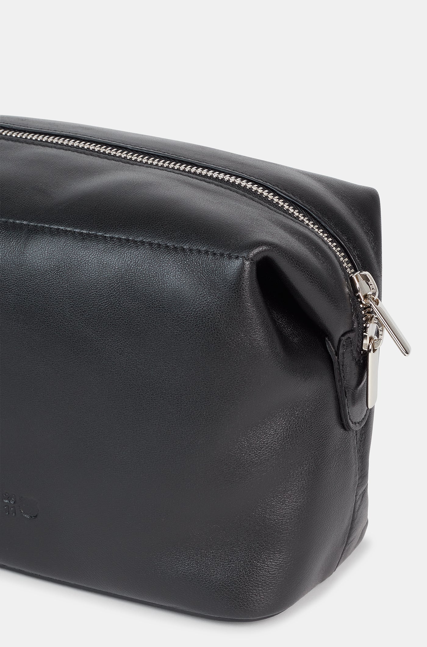 Black leather toiletry bag with a side handle and a silver zipper, featuring an embossed FC Barcelona logo.