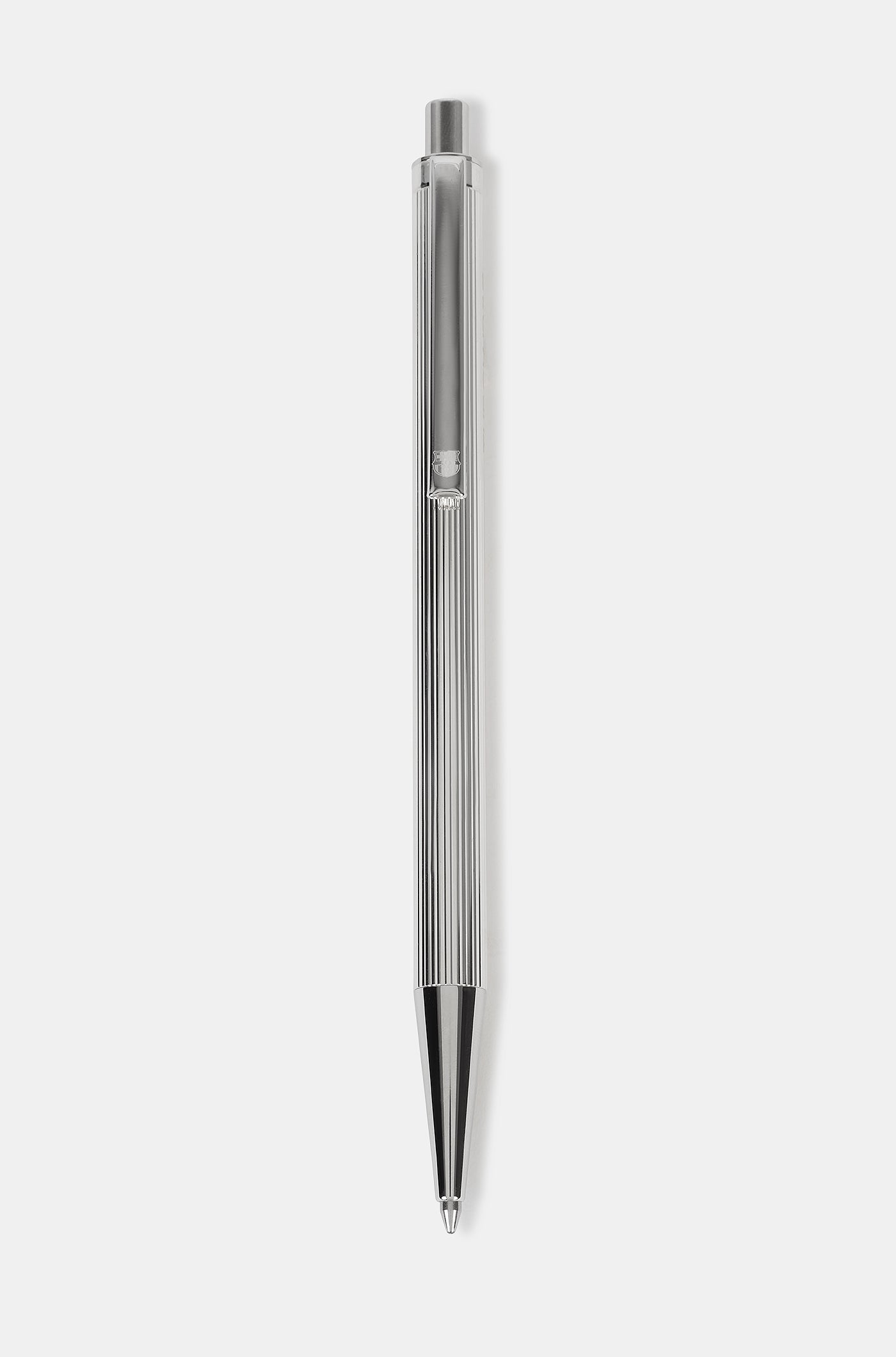 Close-up of a silver metallic pen engraved with "THE CLUB" and a small FC Barcelona logo.