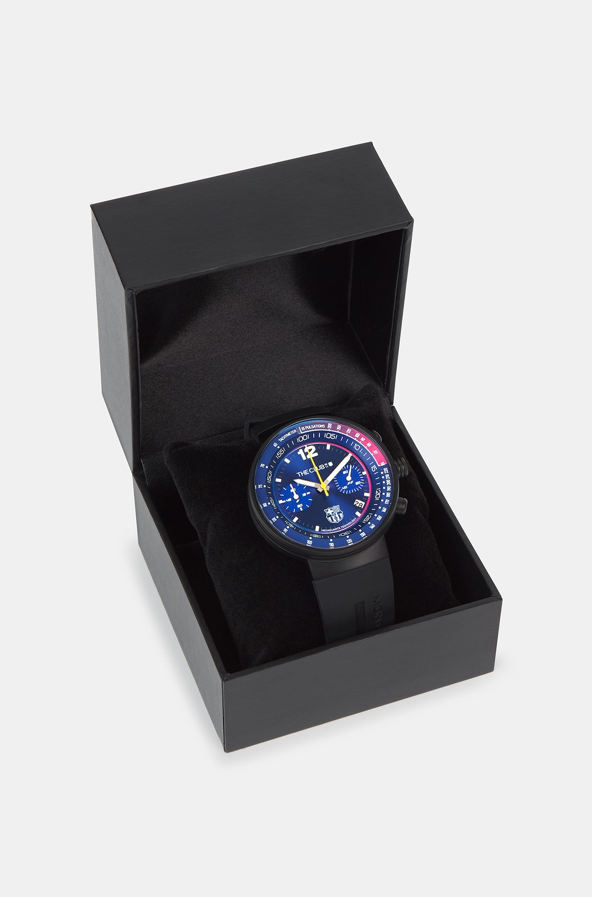 Black wristwatch with FC Barcelona crest, presented in a black box. The watch face is predominantly blue with red and blue details on the dial, white markings, and a yellow second hand.