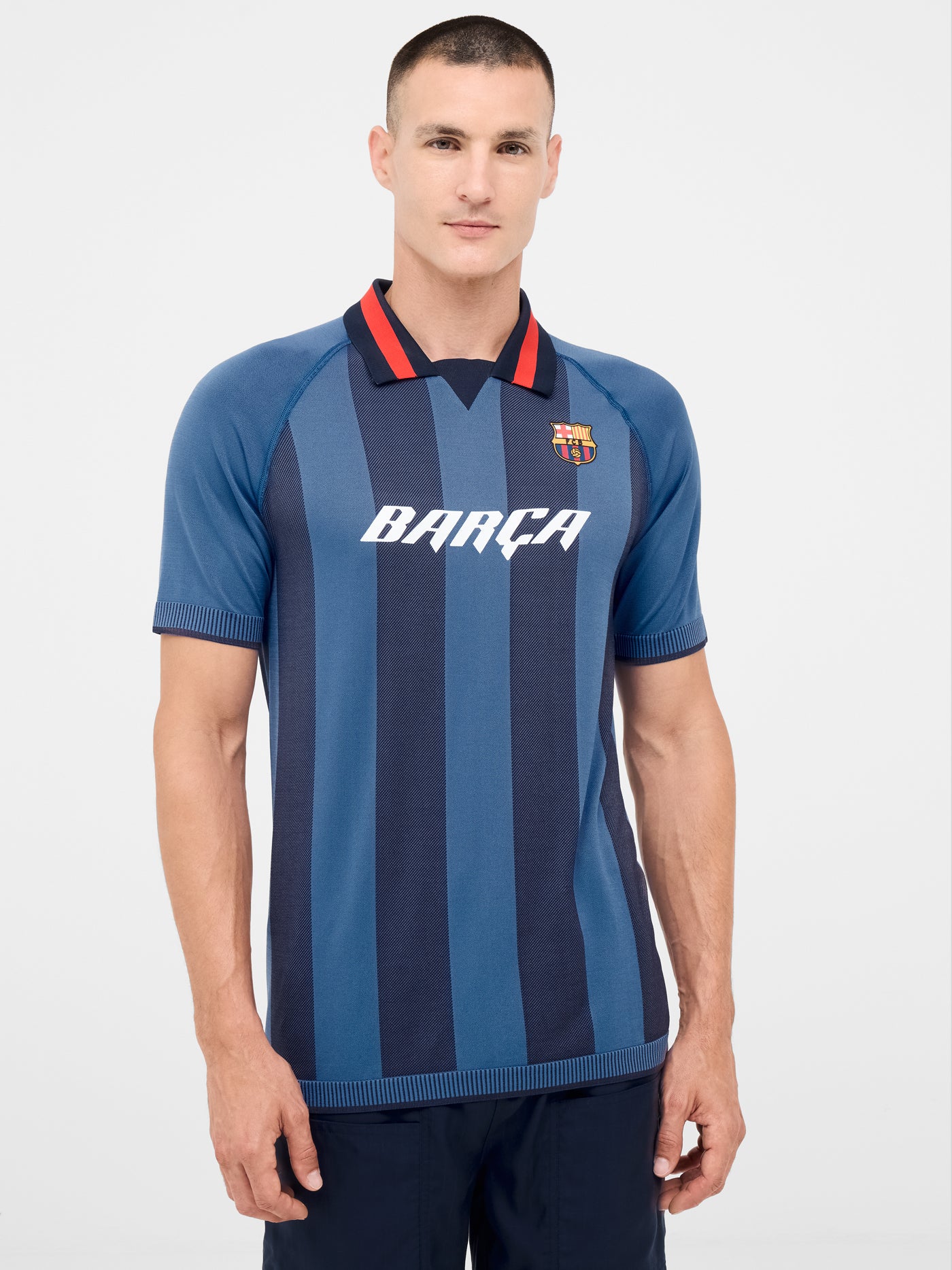 Blue striped polo with shield