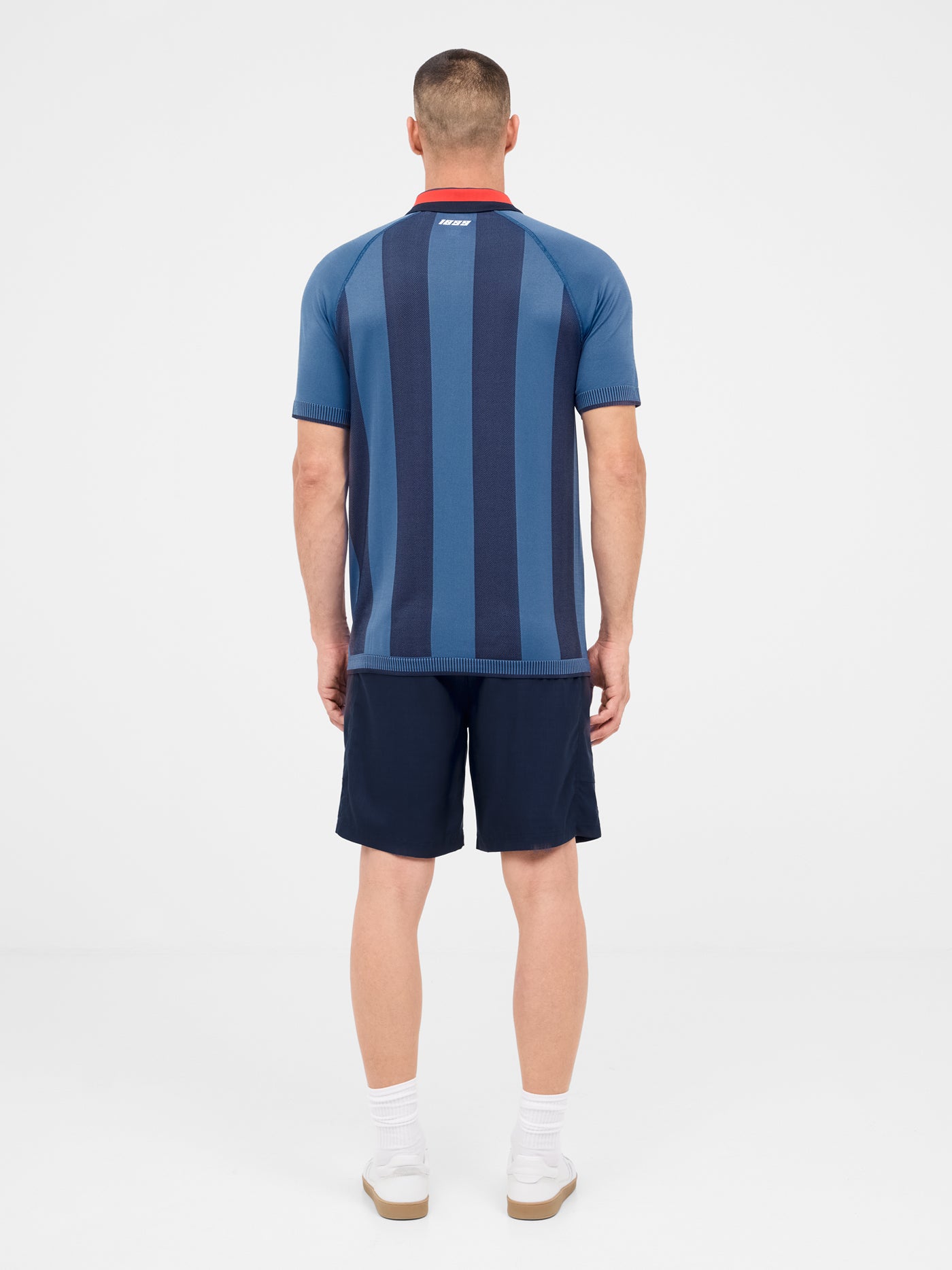 Blue striped polo with shield