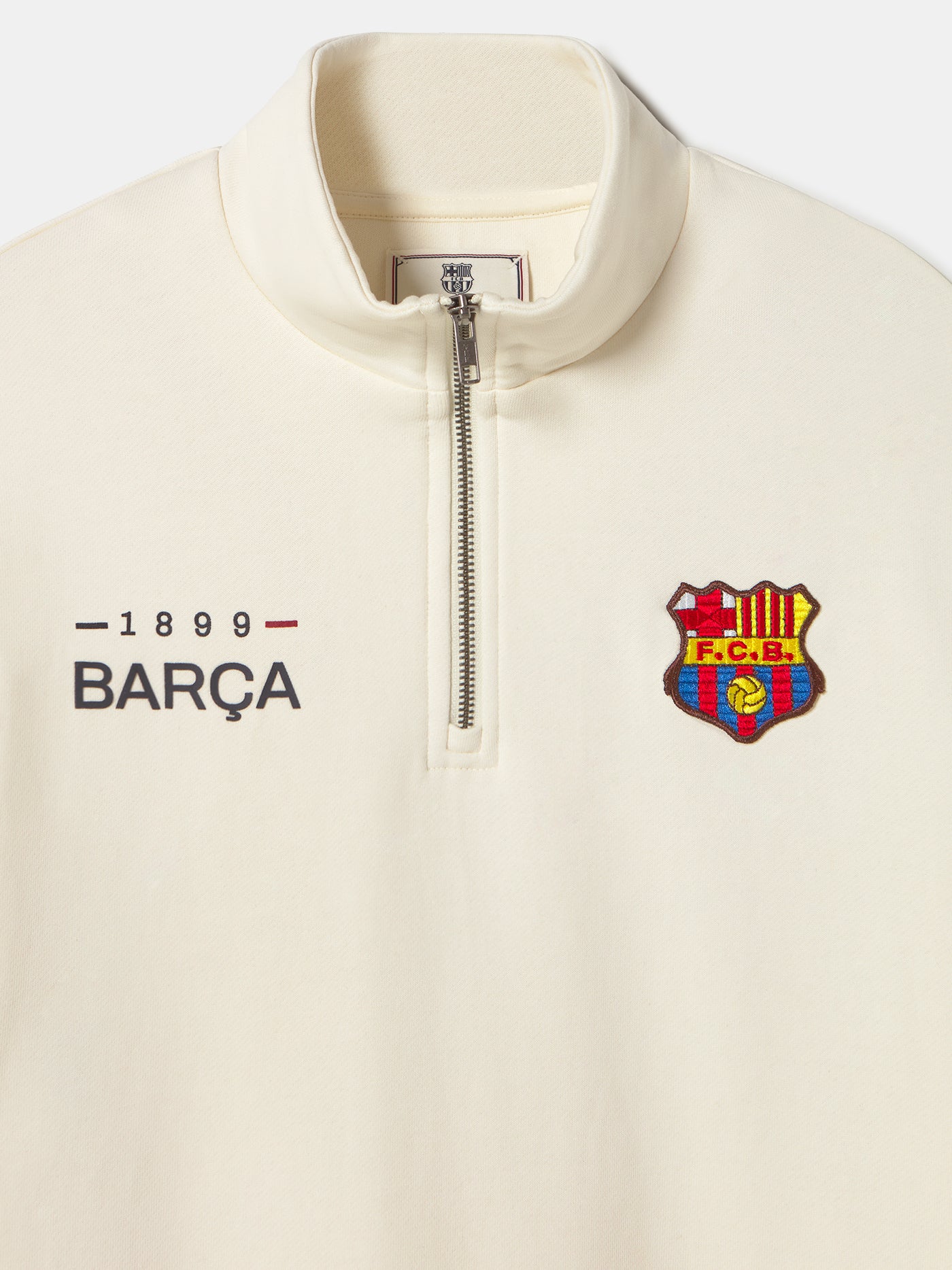 cream-colored Barça sweatshirt with red and navy sleeve stripes and embroidered club crest