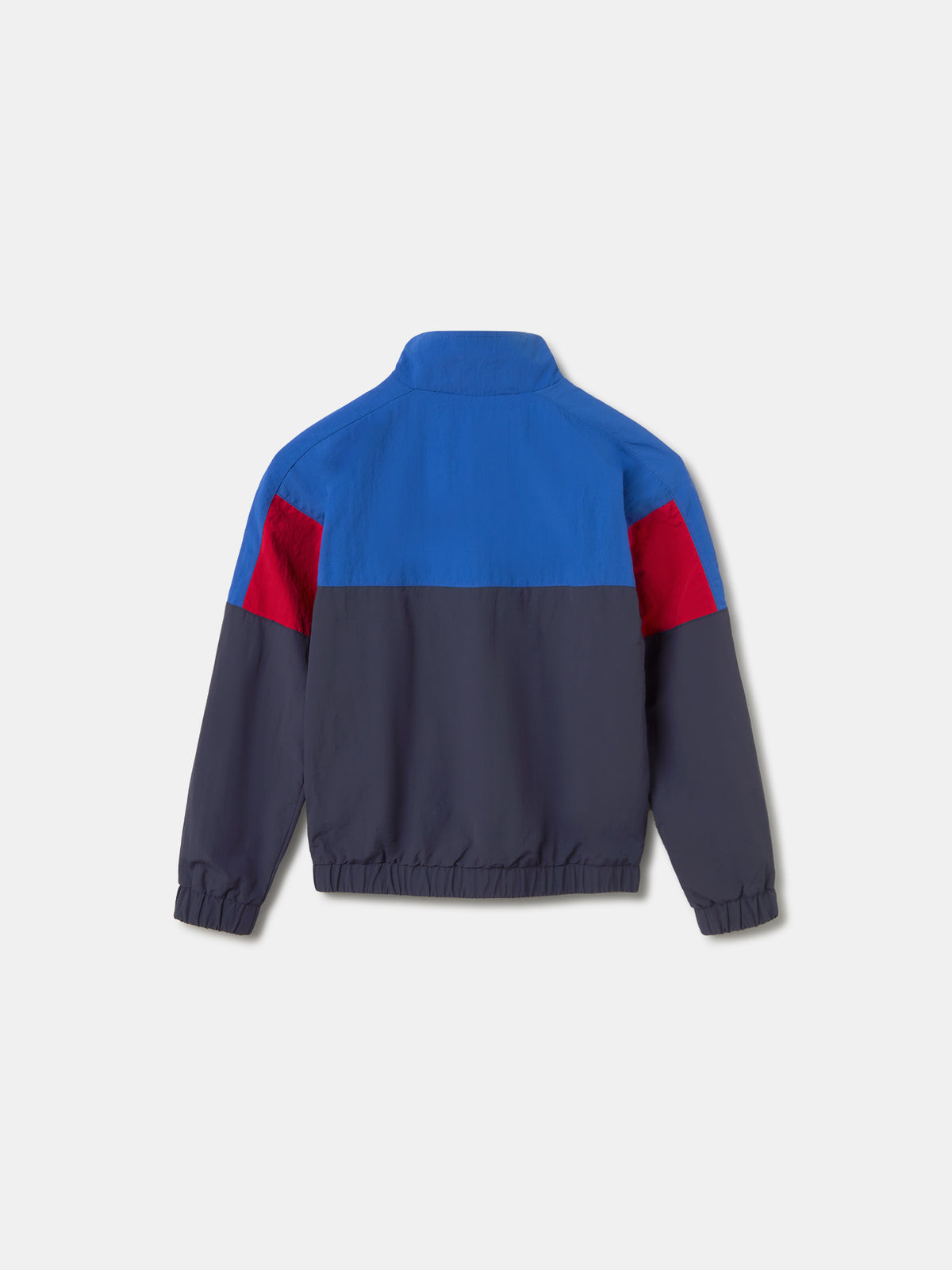 Color-block windbreaker jacket in blue, red, and navy with FC Barcelona crest on the chest