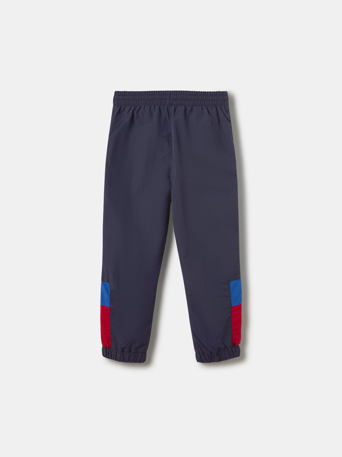 Navy jogger pants with FC Barcelona crest on the upper leg and red and blue color blocks on the knees.