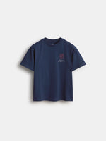 Front view of a navy FC Barcelona T-shirt with a small red club crest and handwritten-style text on the chest.
