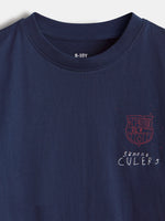 Front view of a navy FC Barcelona shirt with a small red crest and “Sempre Culers” text on the chest.