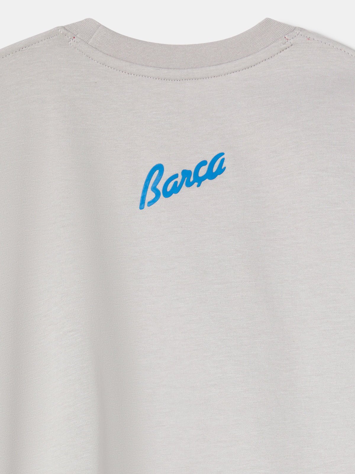 light grey FC Barcelona t-shirt featuring an oversized colorful club crest on the front.
