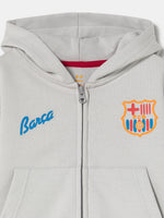 light grey FC Barcelona zip-up hoodie with the club crest on the chest and "Barça" text embroidered in blue.
