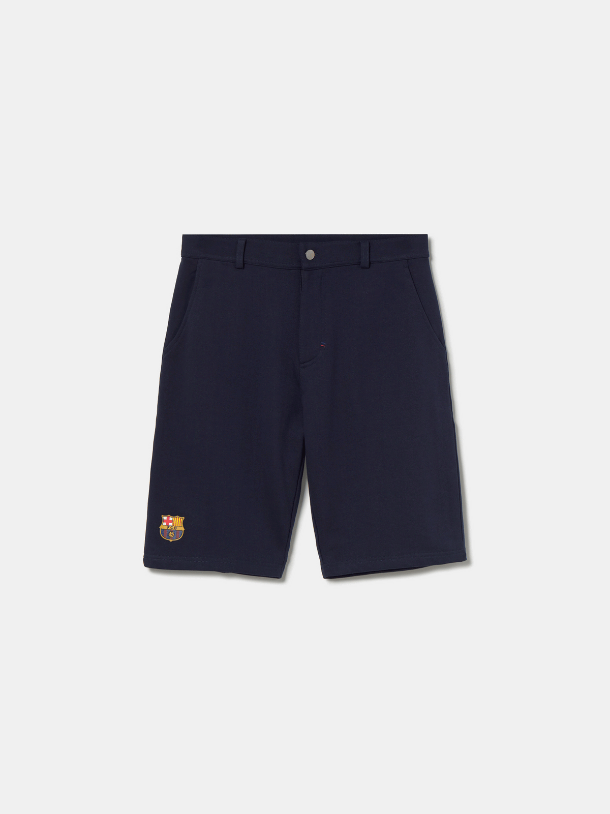 Navy blue FC Barcelona shorts with side pockets and the club crest embroidered near the hem on the left leg