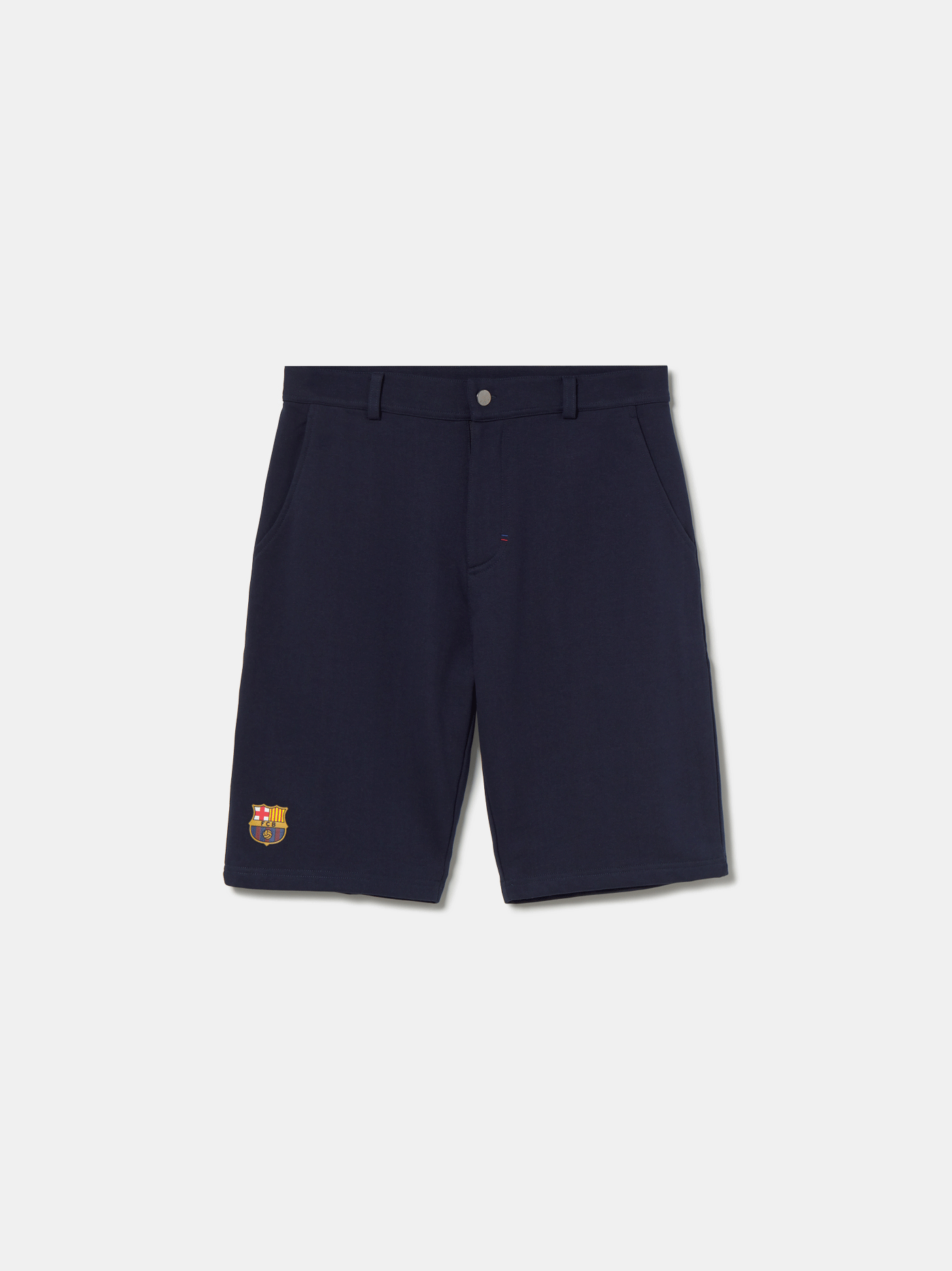 Navy blue FC Barcelona shorts with side pockets and the club crest embroidered near the hem on the left leg