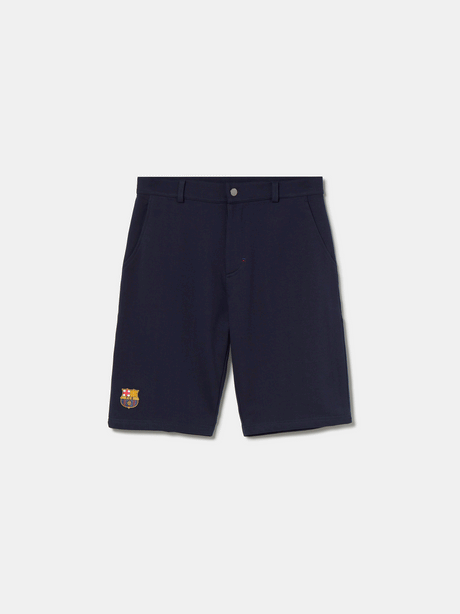 Navy blue FC Barcelona shorts with side pockets and the club crest embroidered near the hem on the left leg