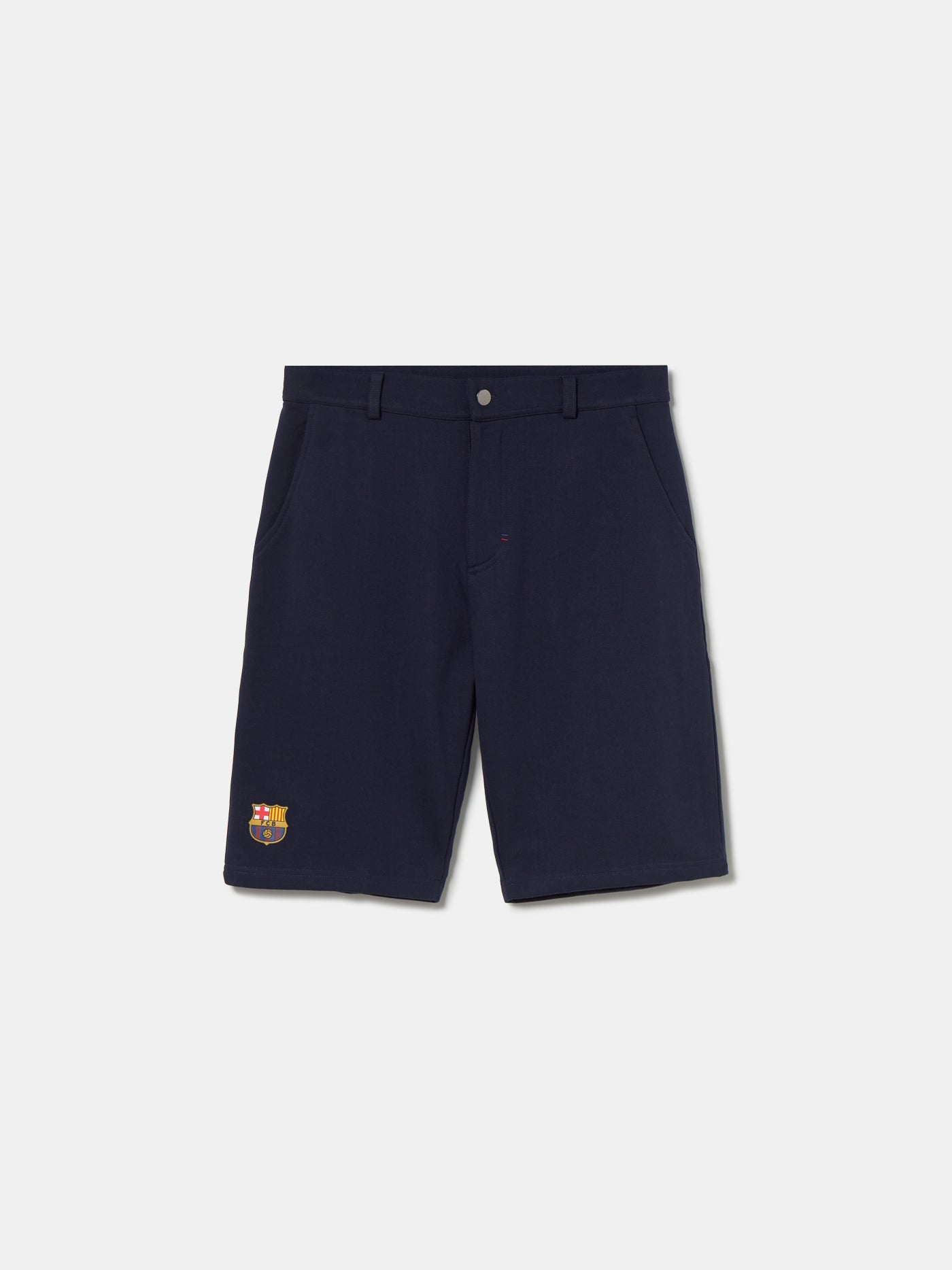Navy blue FC Barcelona shorts with side pockets and the club crest embroidered near the hem on the left leg