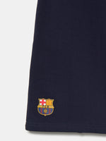 Navy blue FC Barcelona shorts with side pockets and the club crest embroidered near the hem on the left leg