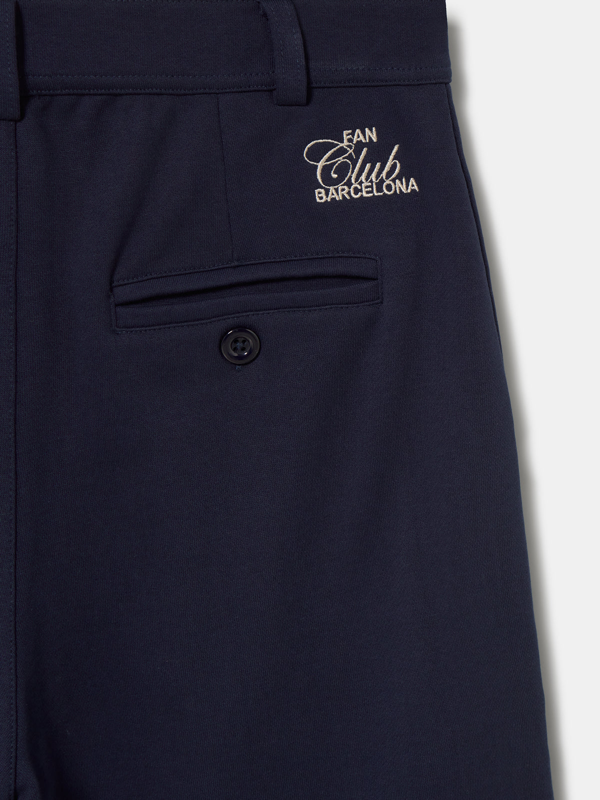 Navy blue FC Barcelona shorts with side pockets and the club crest embroidered near the hem on the left leg