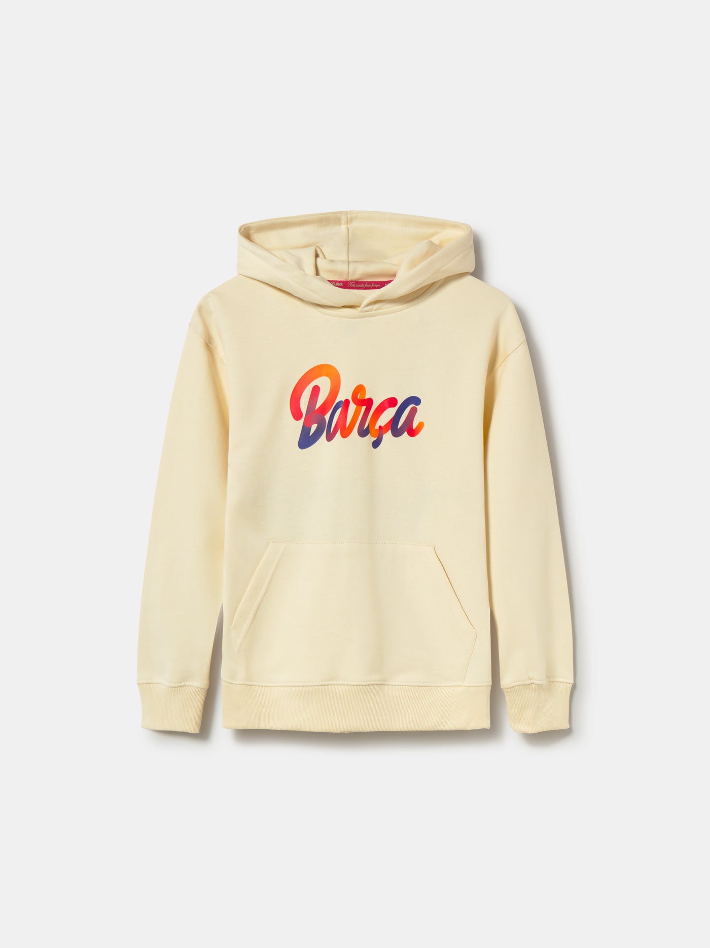 Beige FC Barcelona hoodie for kids, featuring a colorful 'Barça' text on the front and 'Futbol Club Barcelona - Tots units fem força' with the club crest on the back