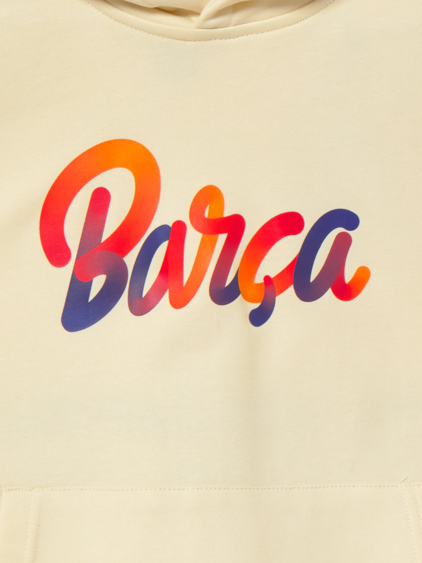 Beige FC Barcelona hoodie for kids, featuring a colorful 'Barça' text on the front and 'Futbol Club Barcelona - Tots units fem força' with the club crest on the back