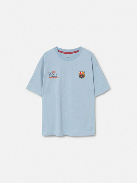 light grey FC Barcelona t-shirt with a large gradient club crest printed on the back, along with the text "Futbol Club Barcelona" and the motto "Tots units fem força