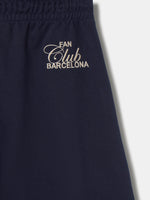 Navy blue FC Barcelona joggers featuring the club crest on the left leg and an elastic waistband with drawstrings