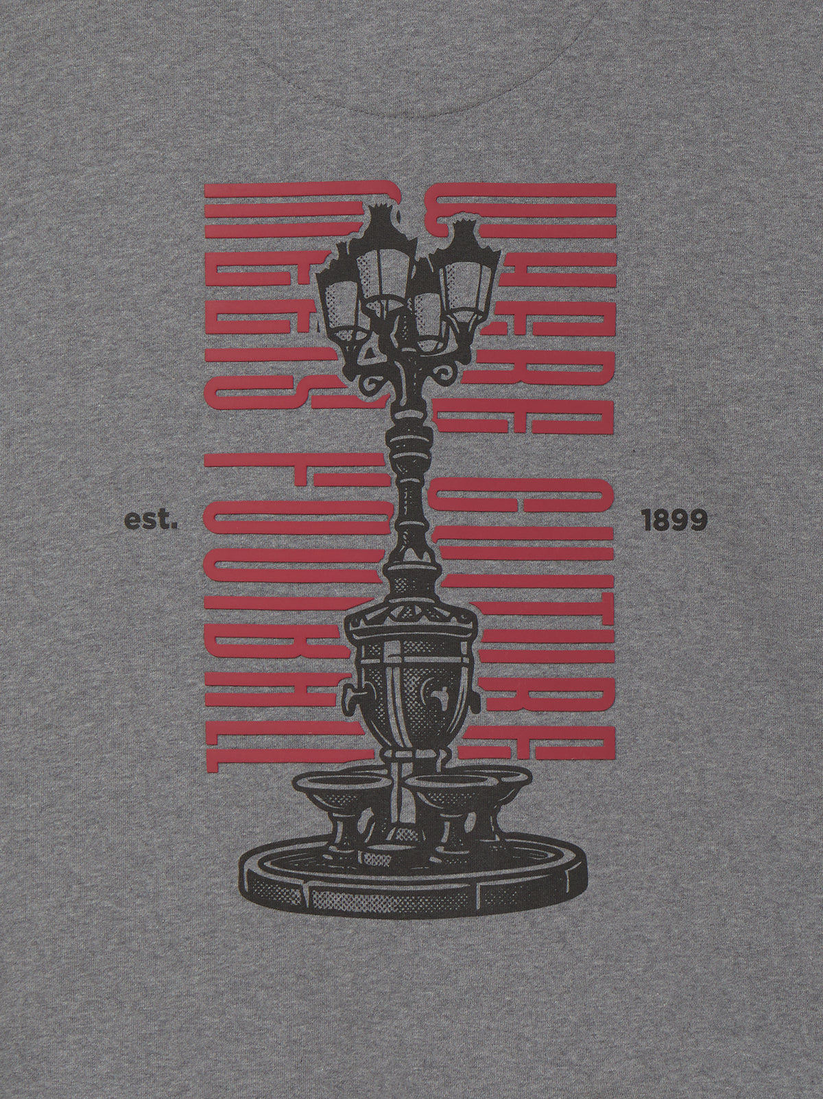 Heather gray T-shirt with a large black vintage streetlamp graphic, red vertical lettering, and small “est. 1899” text on the front.
