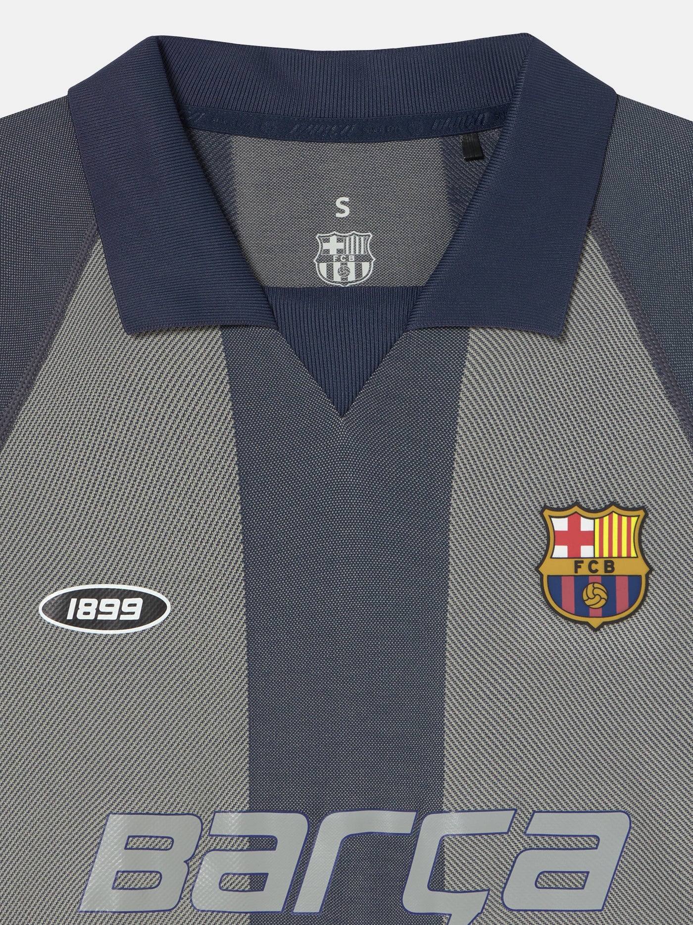 Grey striped retro-style FC Barcelona jersey with crest on the chest and 'Barça' text across the front