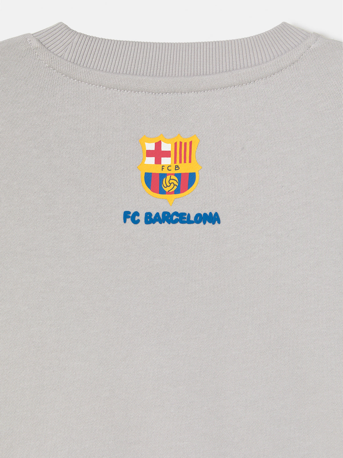  light grey FC Barcelona sweatshirt with a cartoon footballer and the word 'Barça' in blue