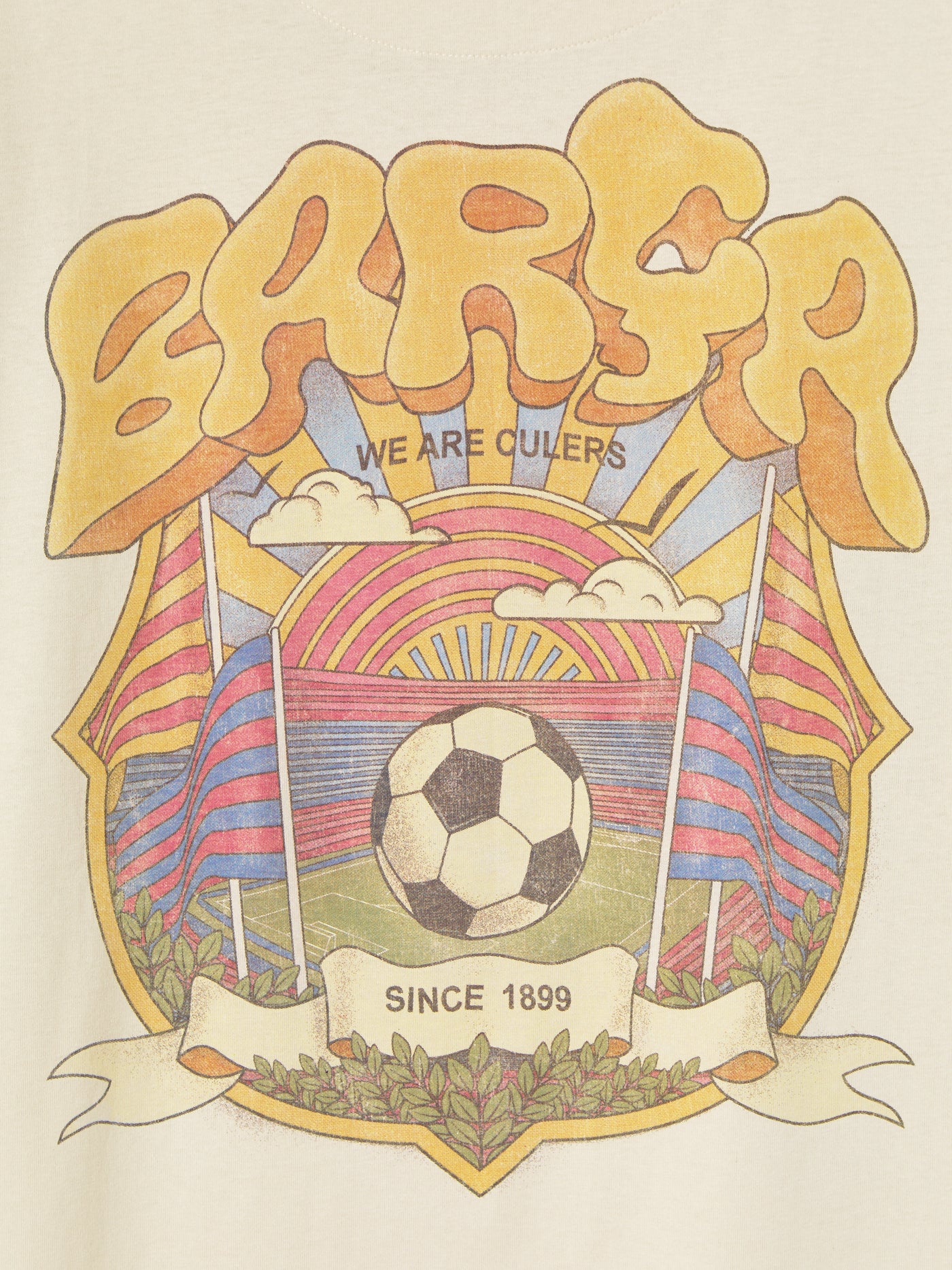 Beige FC Barcelona T-shirt featuring a vibrant vintage-style back print with the word "Barça" in large retro bubble letters. The graphic includes a football, flags, and stadium elements in bold colors within a shield-like frame. A ribbon below the design reads “Since 1899” and “Més que un club.”