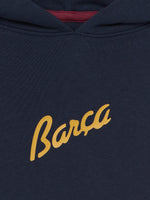 Navy hoodie with FC Barcelona crest and 'Més que un club' slogan printed on the back.
