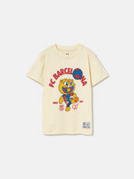 cream FC Barcelona T-shirt featuring the club's name and Cat Culer, the cartoon mascot, playing football.