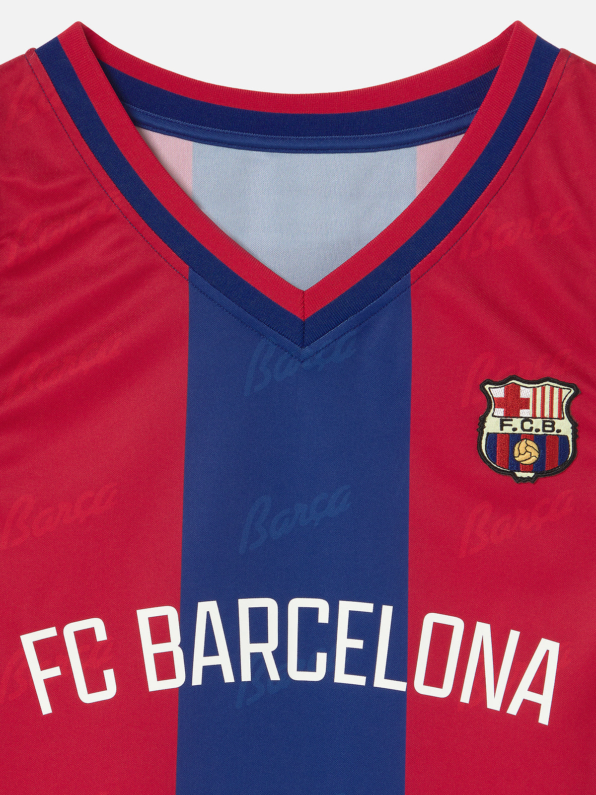 Red and blue sports jersey with FC Barcelona logo and text