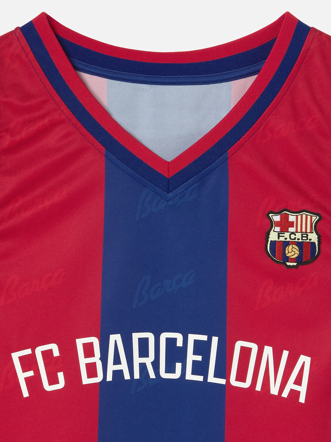 Red and blue sports jersey with FC Barcelona logo and text