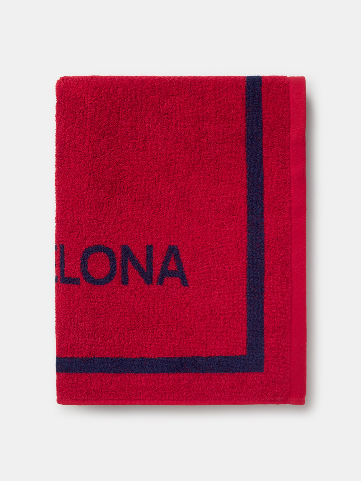 Red FC Barcelona towel featuring the word "Barça" in large navy script, with "TOTS UNITS FEM FORÇA" vertically on the left and "FC BARCELONA" with club crest on the right side