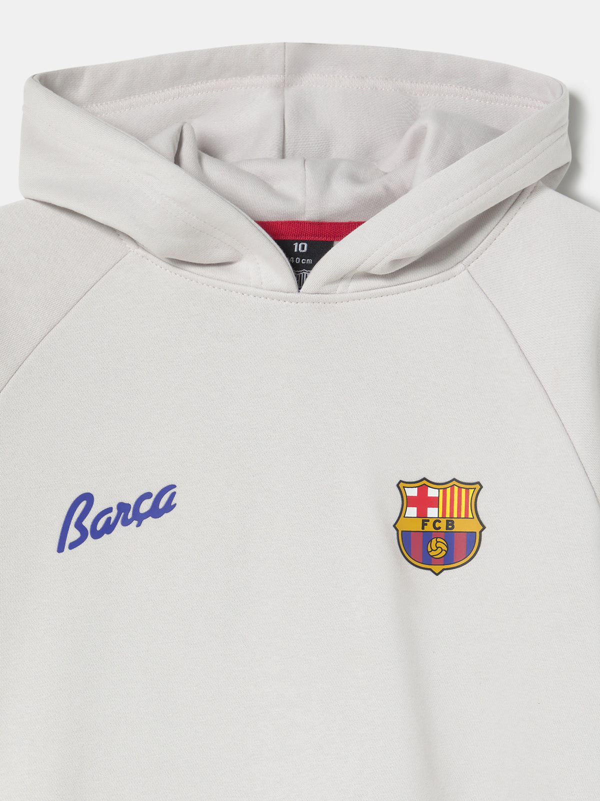 White FC Barcelona hoodie featuring a unique back design with a four-petal flower made of circular emblems: the St. George cross, Catalan flag, blaugrana stripes, and a central golden football. Below the graphic, the text reads “Futbol Club Barcelona” and “Més que un club” along with minimalist logos.