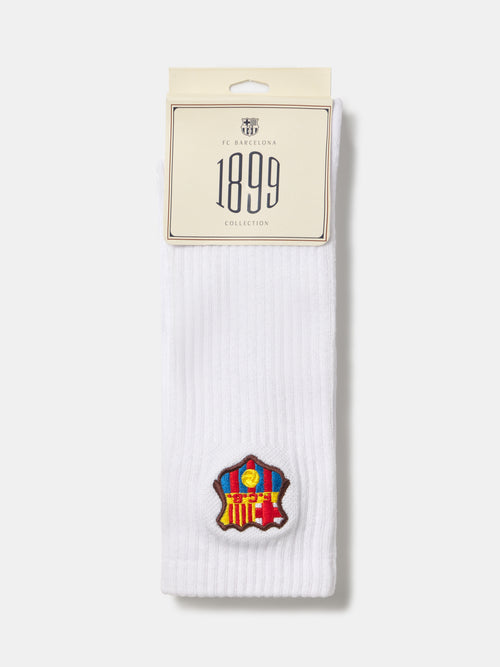 White ribbed FC Barcelona socks packaged with a 1899 Collection tag and the club crest near the cuff.