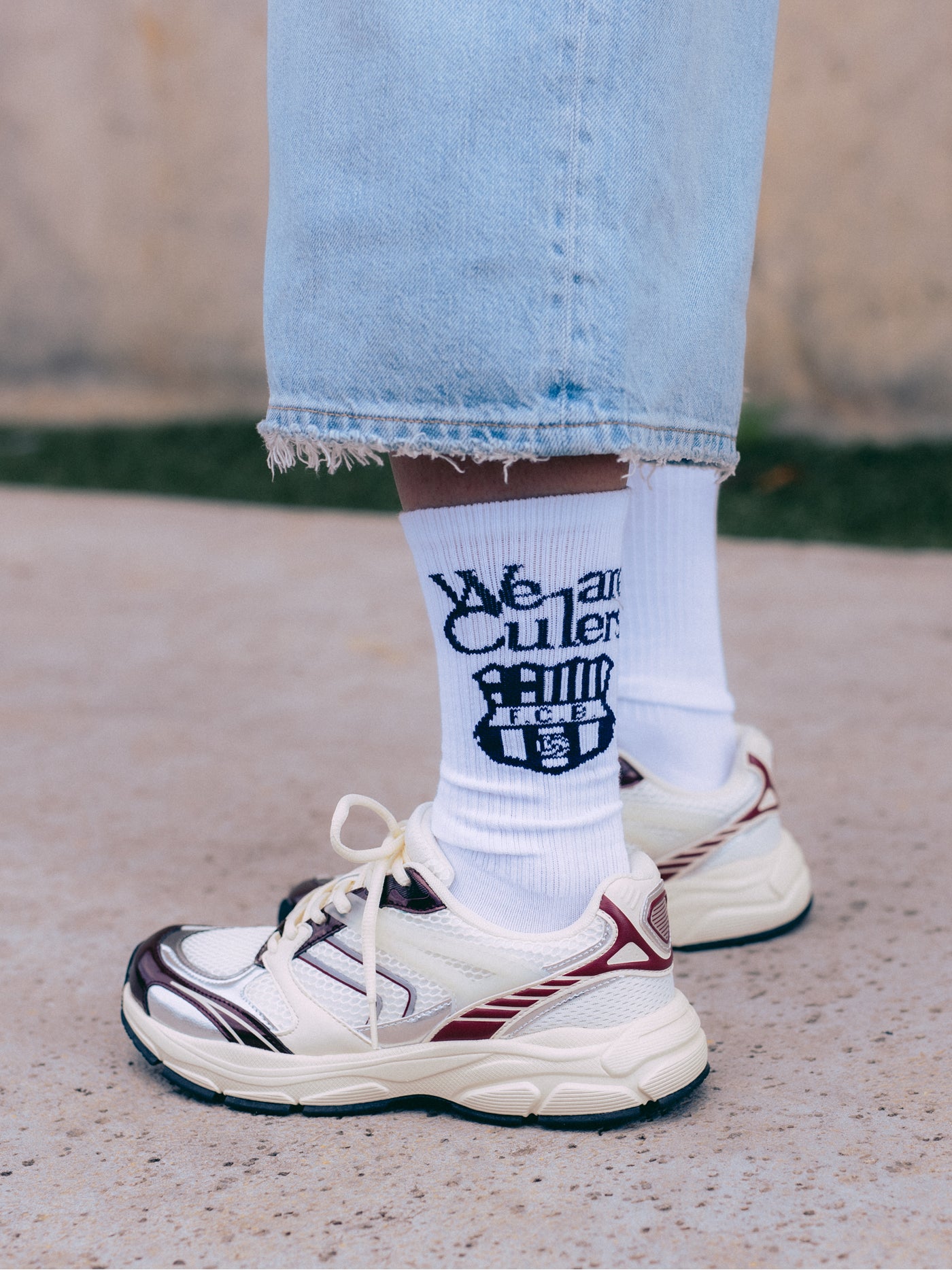 White sock with navy blue 'We are Culers' text and FC Barcelona crest on the calf, and 'FC BARCELONA' written on the foot.