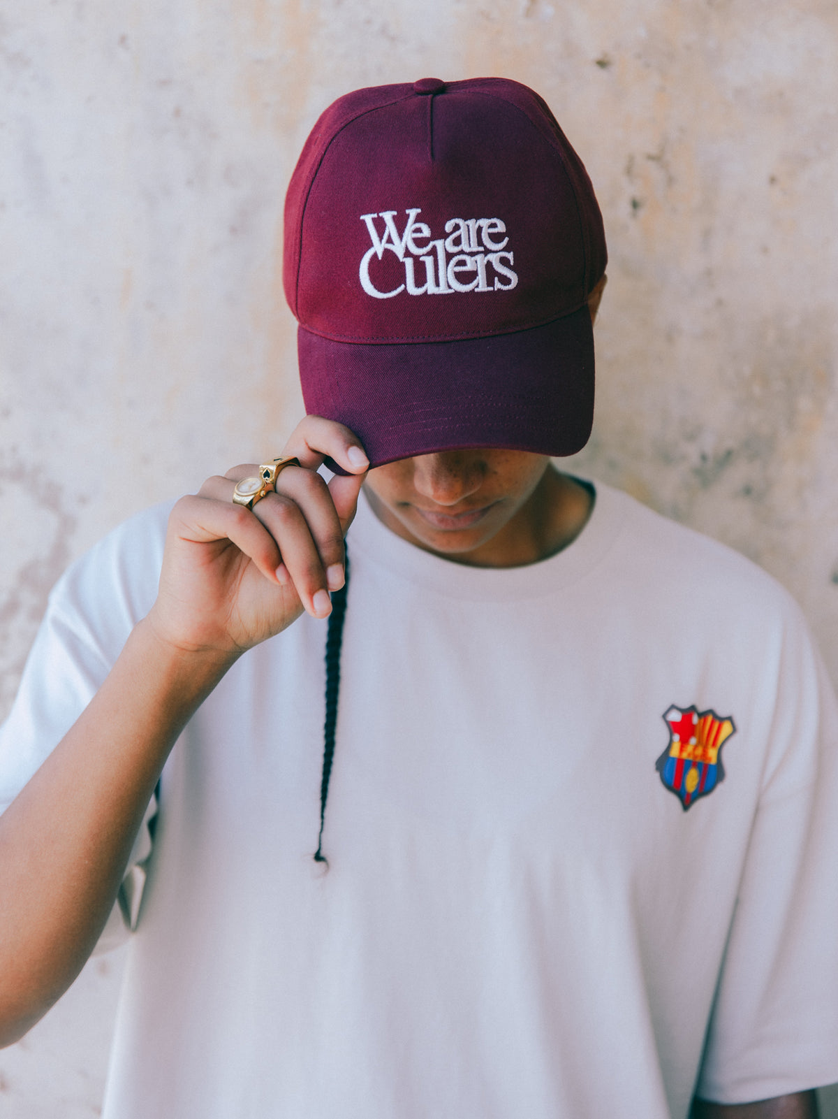 Burgundy cap with the phrase 'We are Culers' embroidered in white on the front. Classic adjustable design inspired by FC Barcelona's colors.