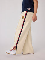 Cream Barça wide-leg trousers with blaugrana side stripe and crest detail.