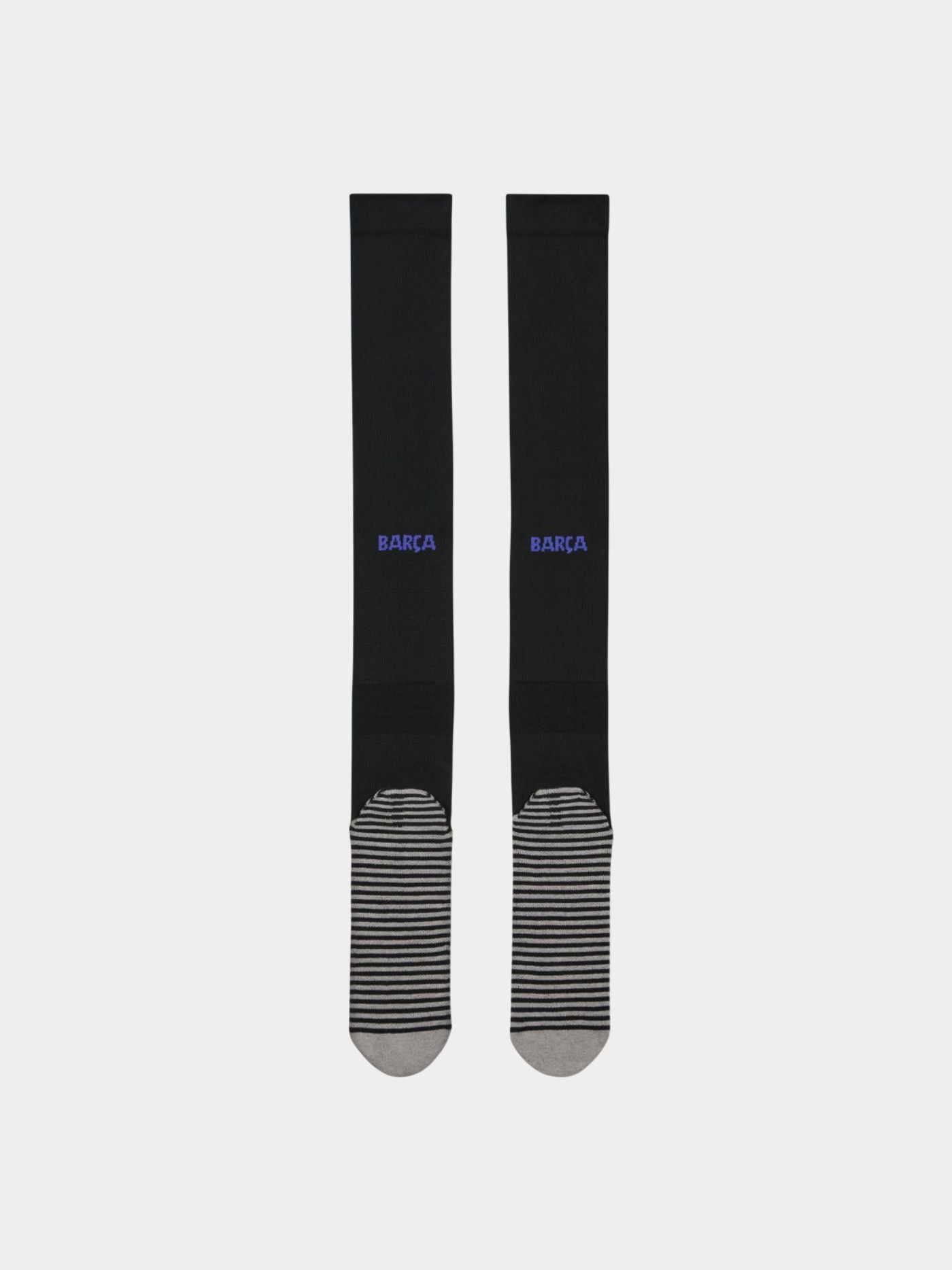 Pair of black FC Barcelona football socks featuring the Kobe Bryant tribute logo in white and reinforced grey-striped soles for grip and comfort