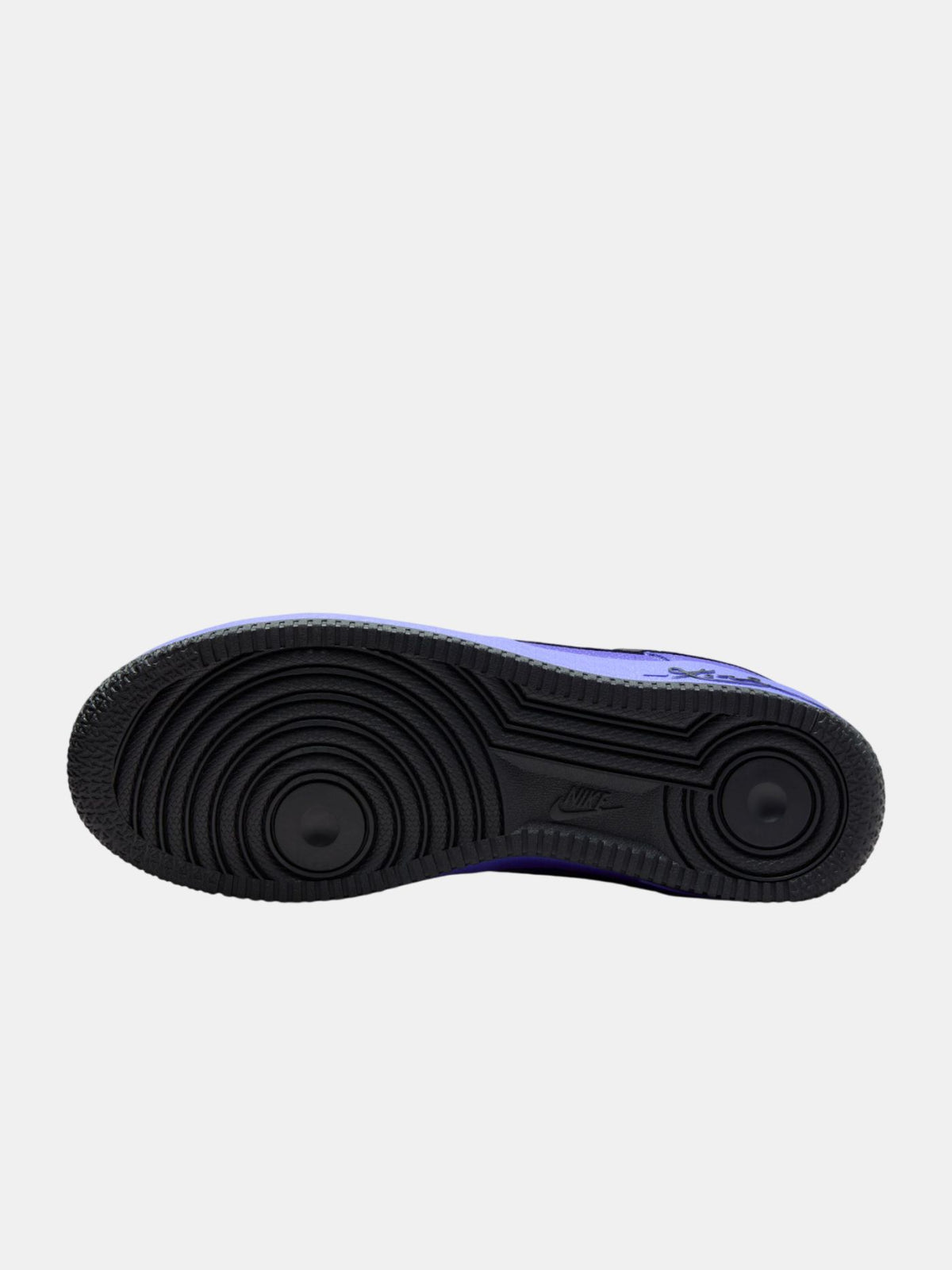 Black sole of a sneaker on a light gray background