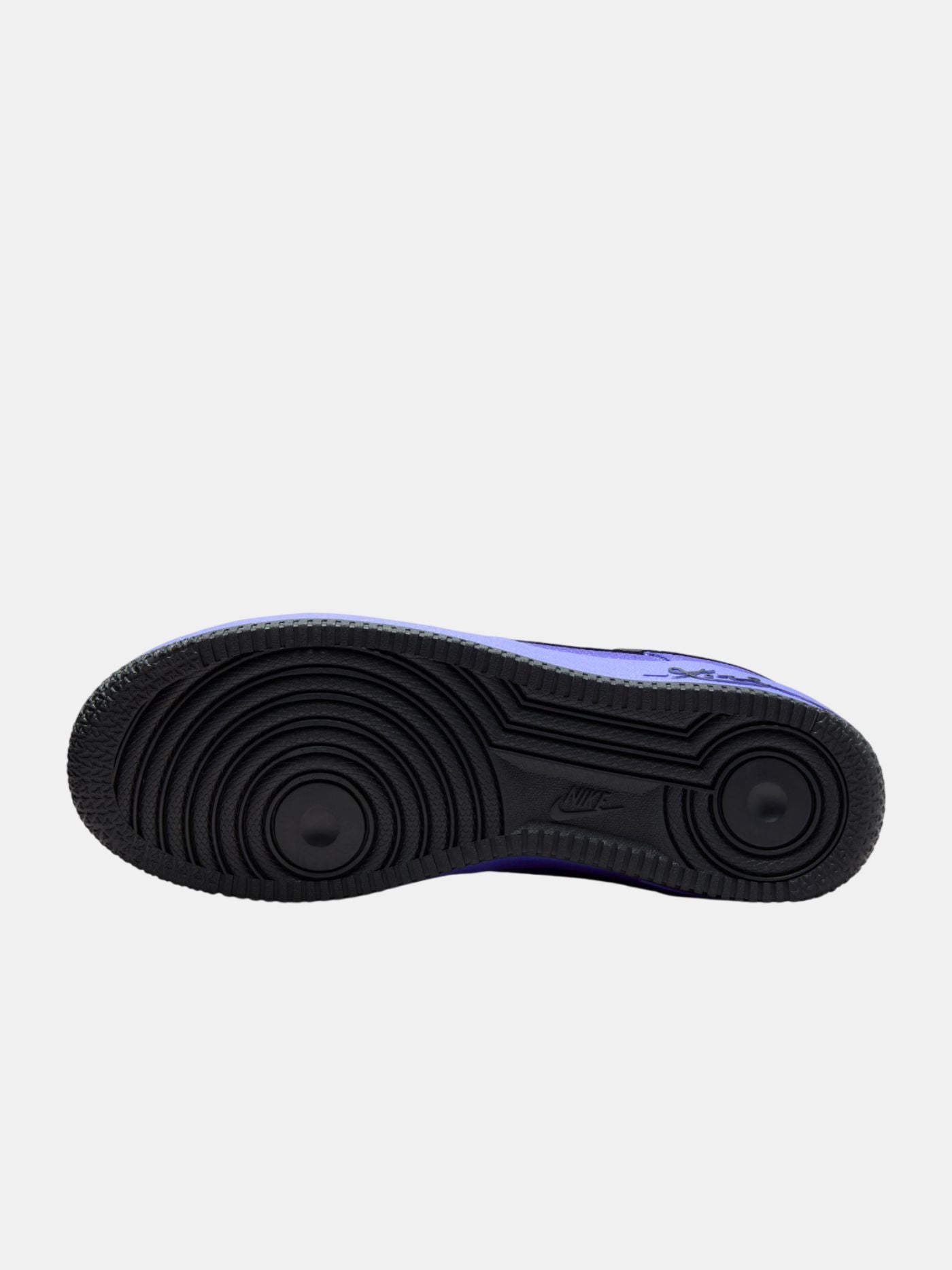 Black sole of a sneaker on a light gray background