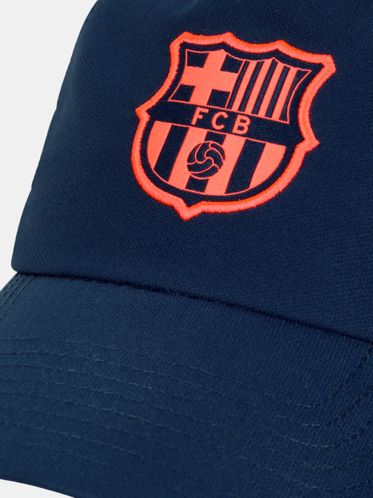 Navy blue FC Barcelona cap featuring the club crest in bright orange on the front