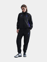 Black FC Barcelona training pants featuring the Kobe Bryant logo and 'FC Barcelona' text in purple on the right thigh.