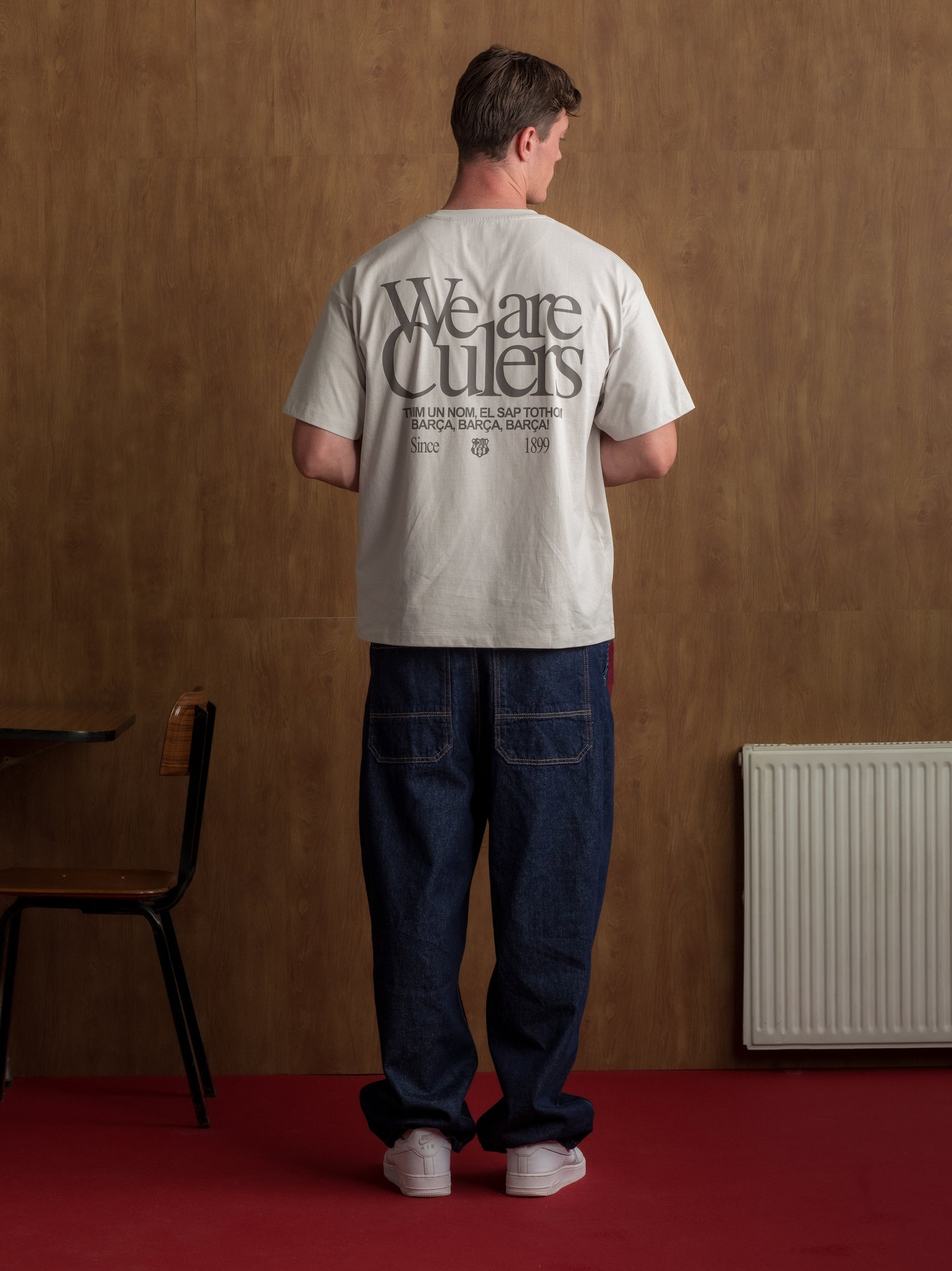 Light grey T-shirt with bold 'We are Culers' text and additional typography on the back.